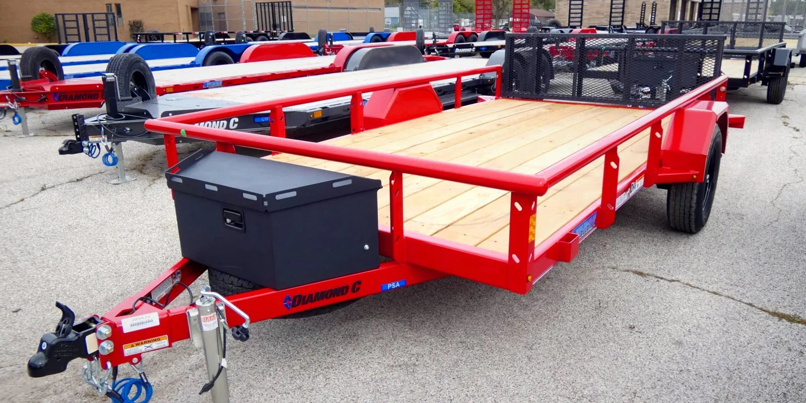 Diamond C utility trailer on a dealer lot