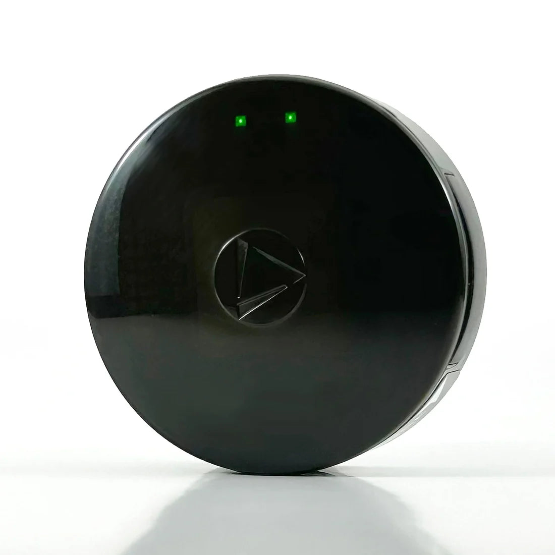 The LandAirSea 54 GPS tracker, shown face on with its status lights lit