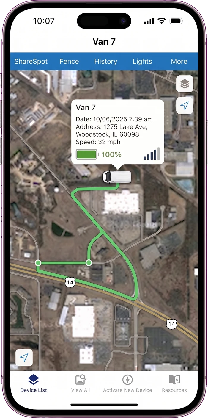 A phone running the SilverCloud app, showing Van 7 tracked on a satellite map with its route through Woodstock, Illinois
